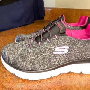 Women’s Skechers size 9.5 wide fit memory foam slip on sneakers.